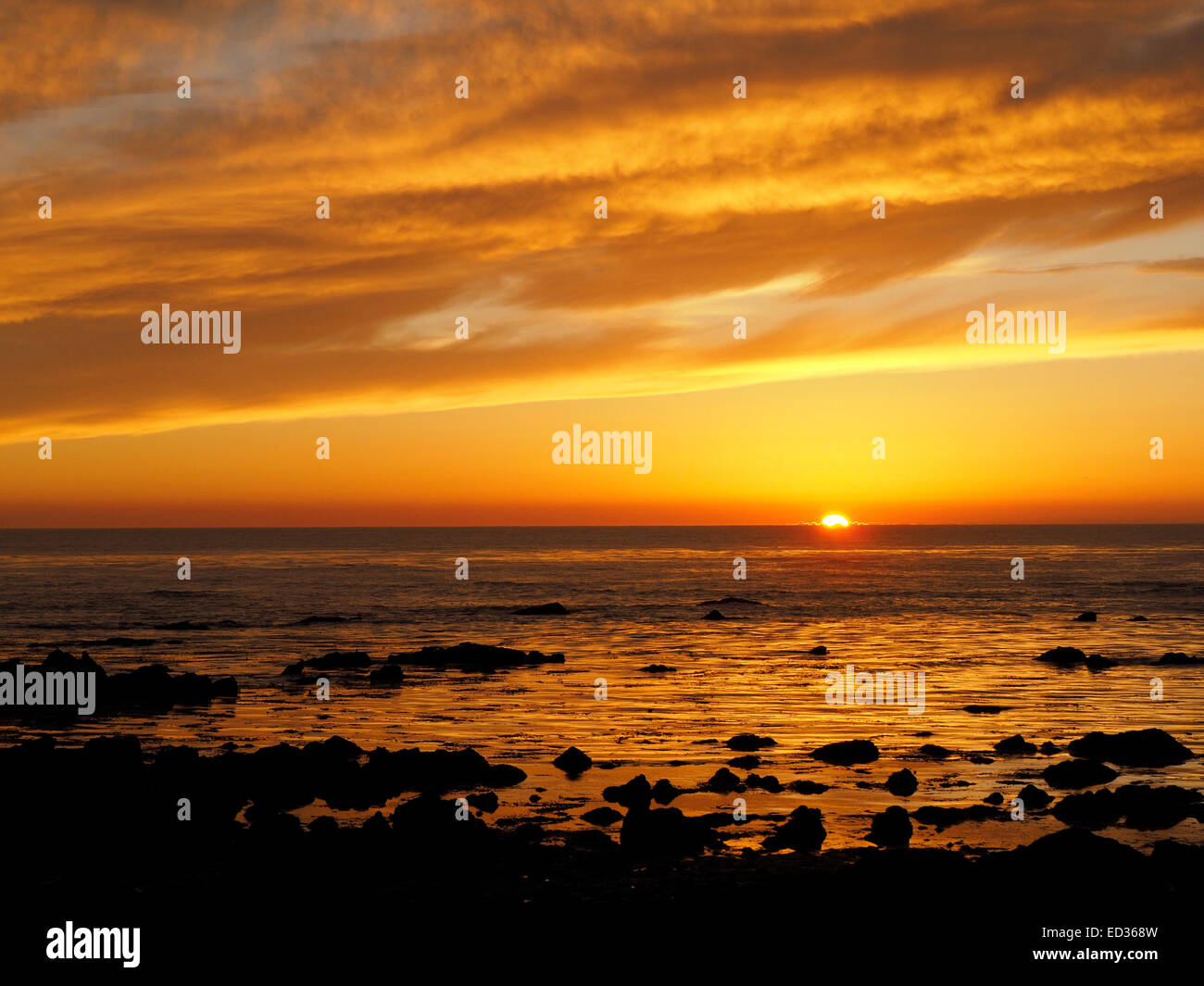 Golden Sky Sunset over the Pacific Ocean Stock Photo