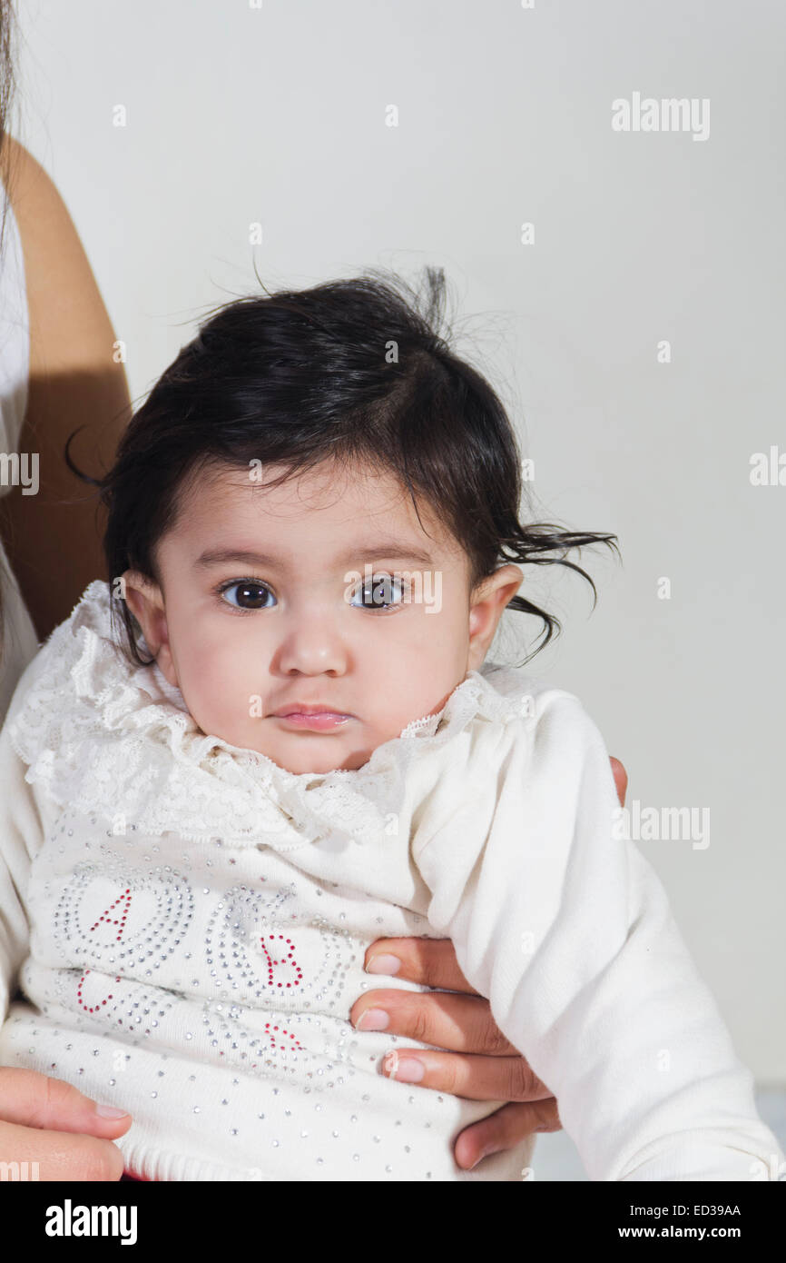 Indian woman carrying baby on hi-res stock photography and images - Alamy