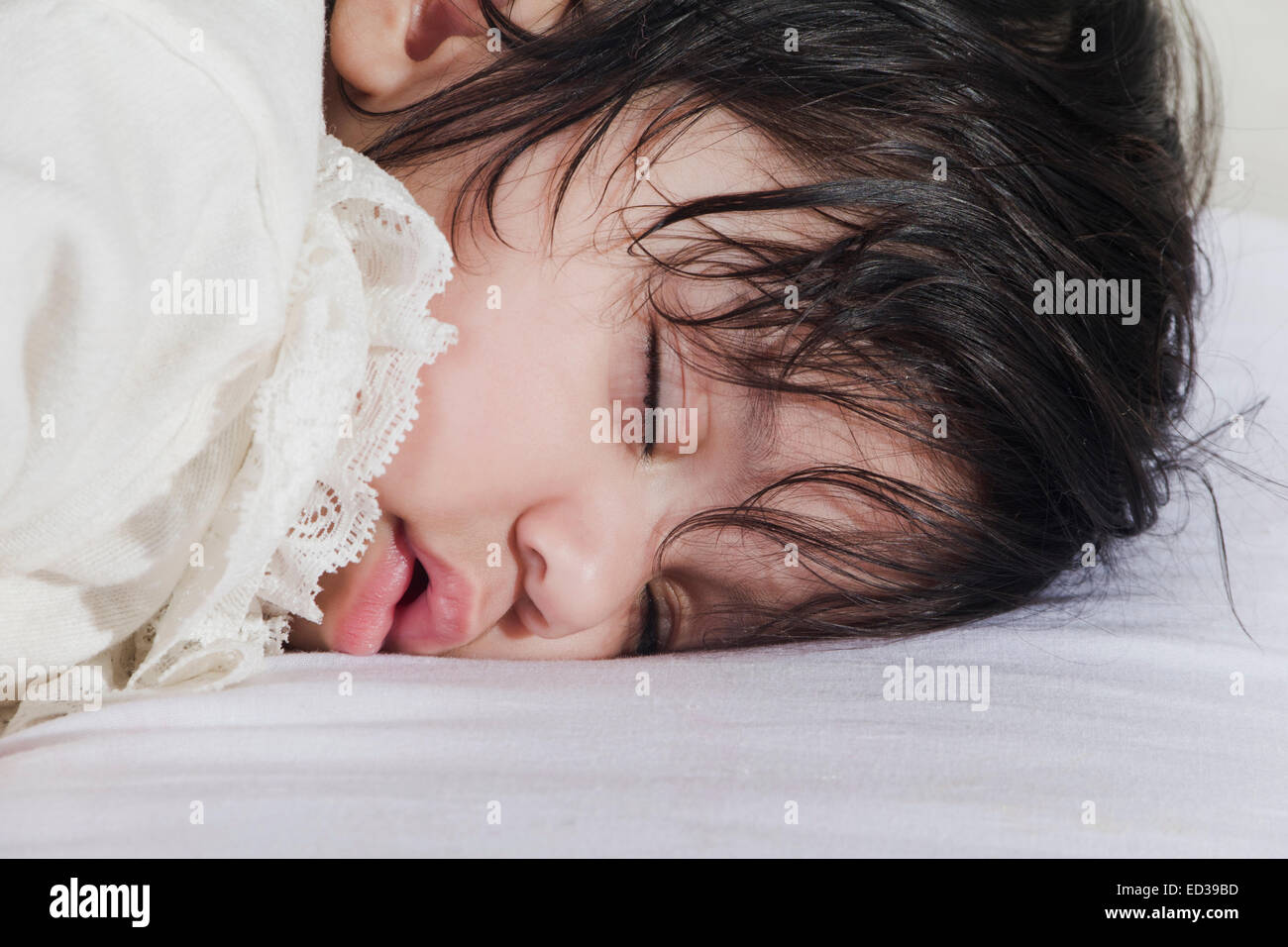 Black baby sleeping on bed hi-res stock photography and images - Alamy