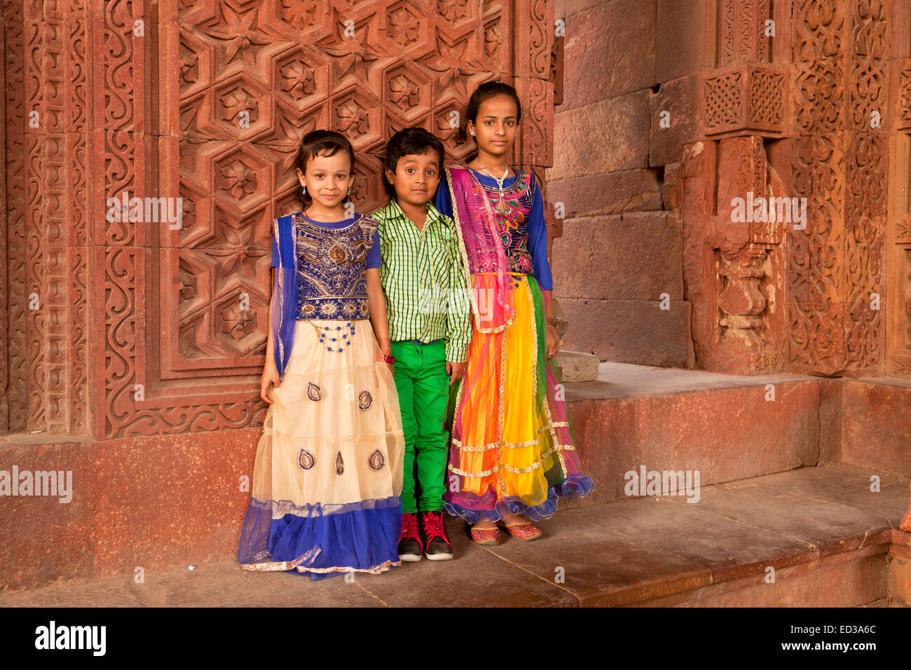 children posing at the Qutb complex, UNESCO World Heritage Site in Delhi, India, Asia Stock Photo