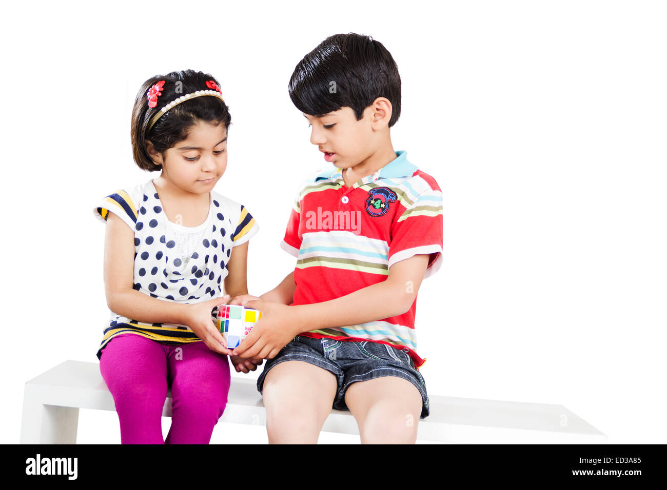 2 indian child friend Playing Puzzle Stock Photo