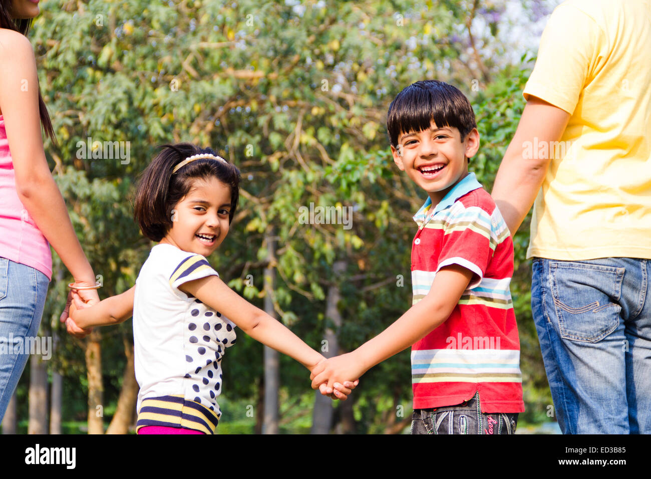 indian Parents with children  park enjoy Stock Photo