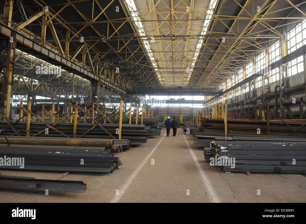 Rambling shop floor is made as steel construction. This production department makes a specialty out of metalworks manufacturing. Stock Photo