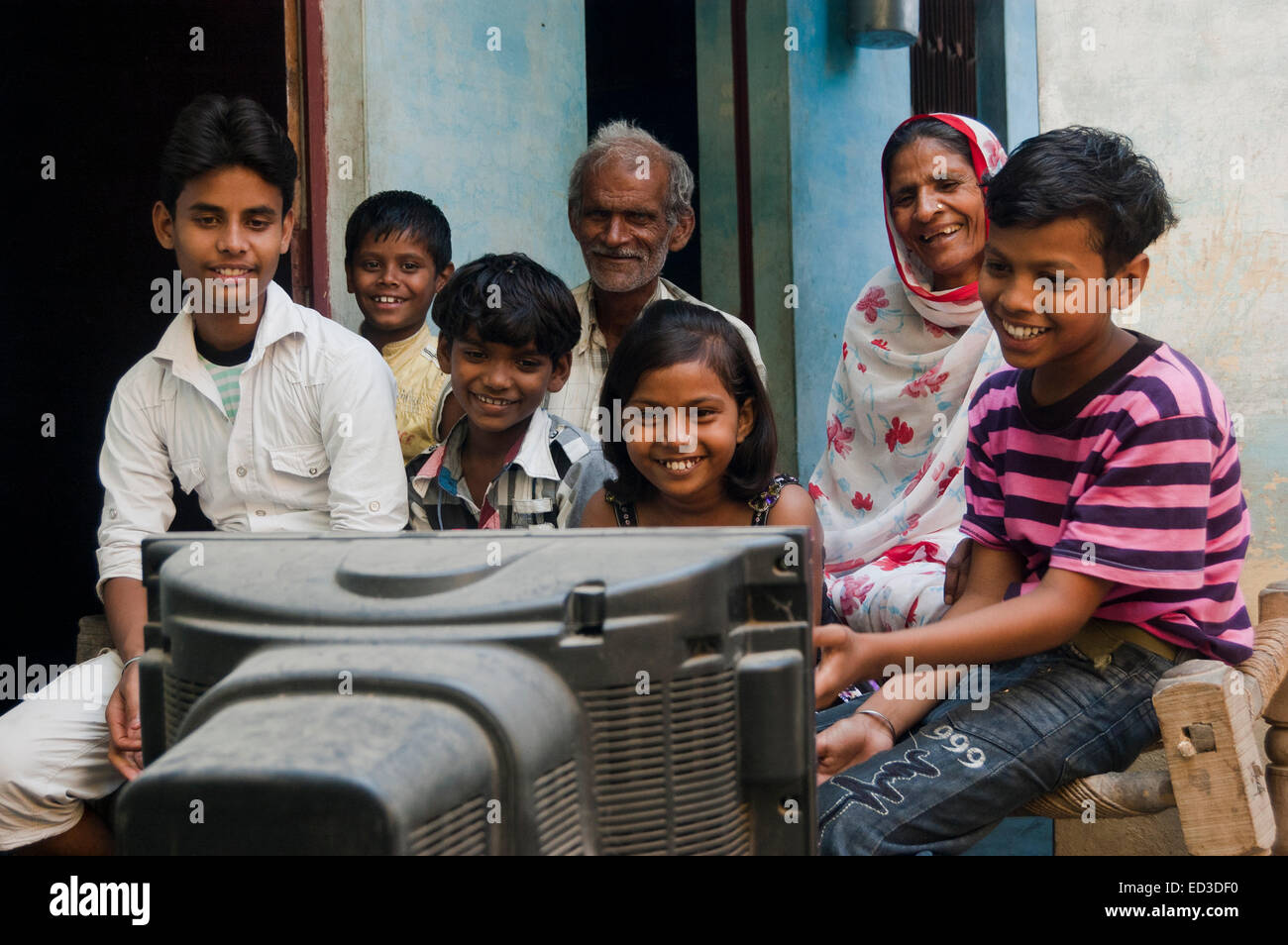 indian rural farmer family watching Television Stock Photo