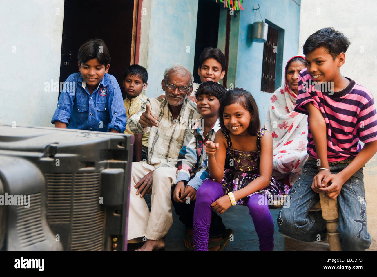 indian rural farmer family watching Television Stock Photo