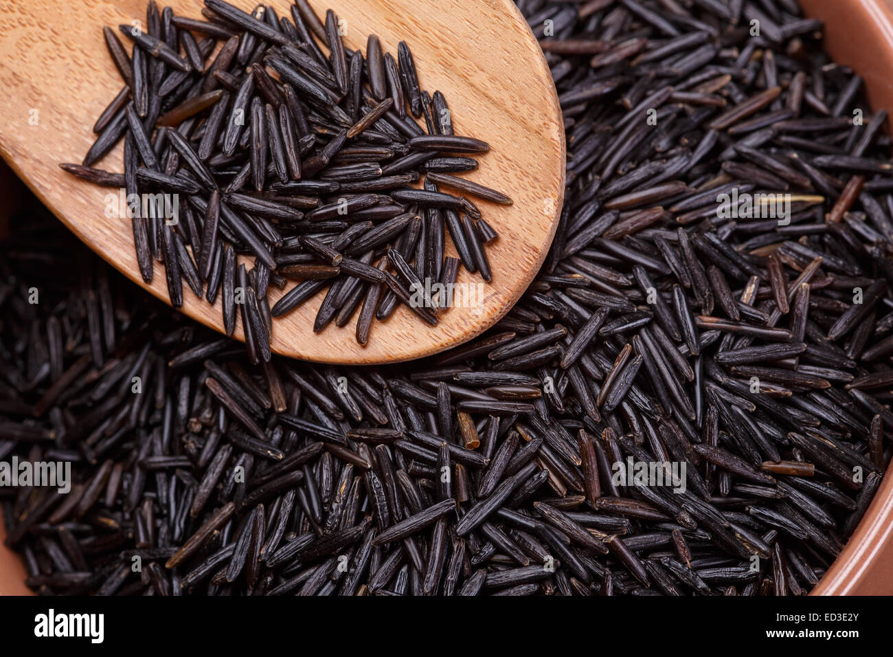 black wild rice grains background Stock Photo Alamy