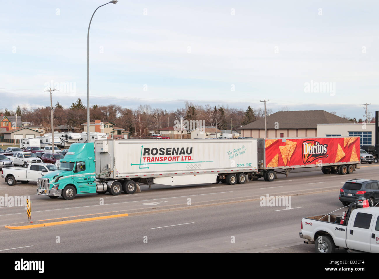 Turnpike doubles passing the Lazy J Motel in Claresholm Alberta Canada