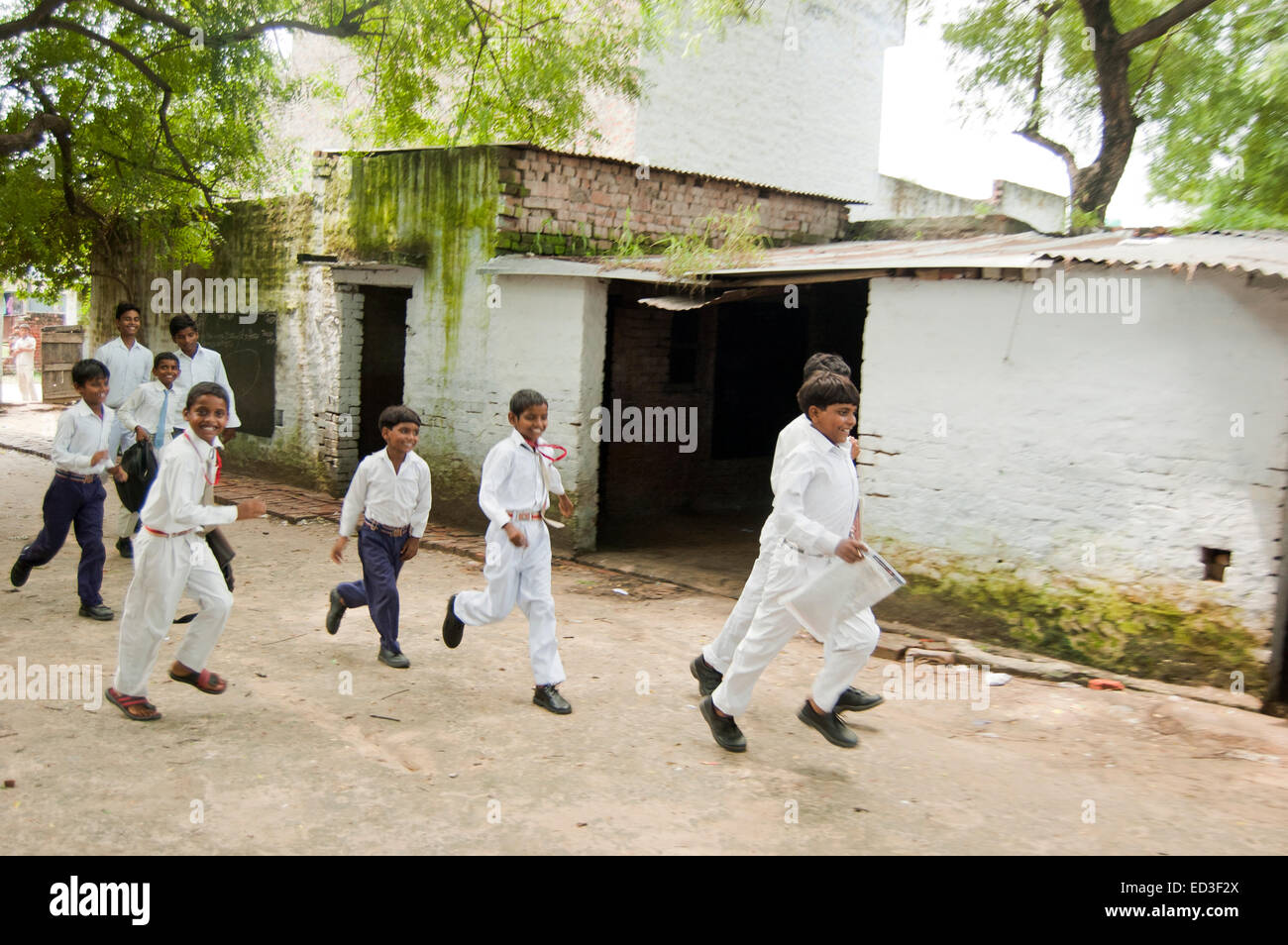 indian rural Children group Students Running Stock Photo