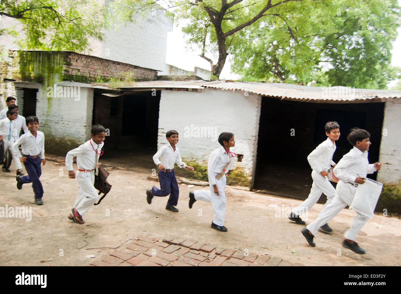 indian rural Children group Students Running Stock Photo