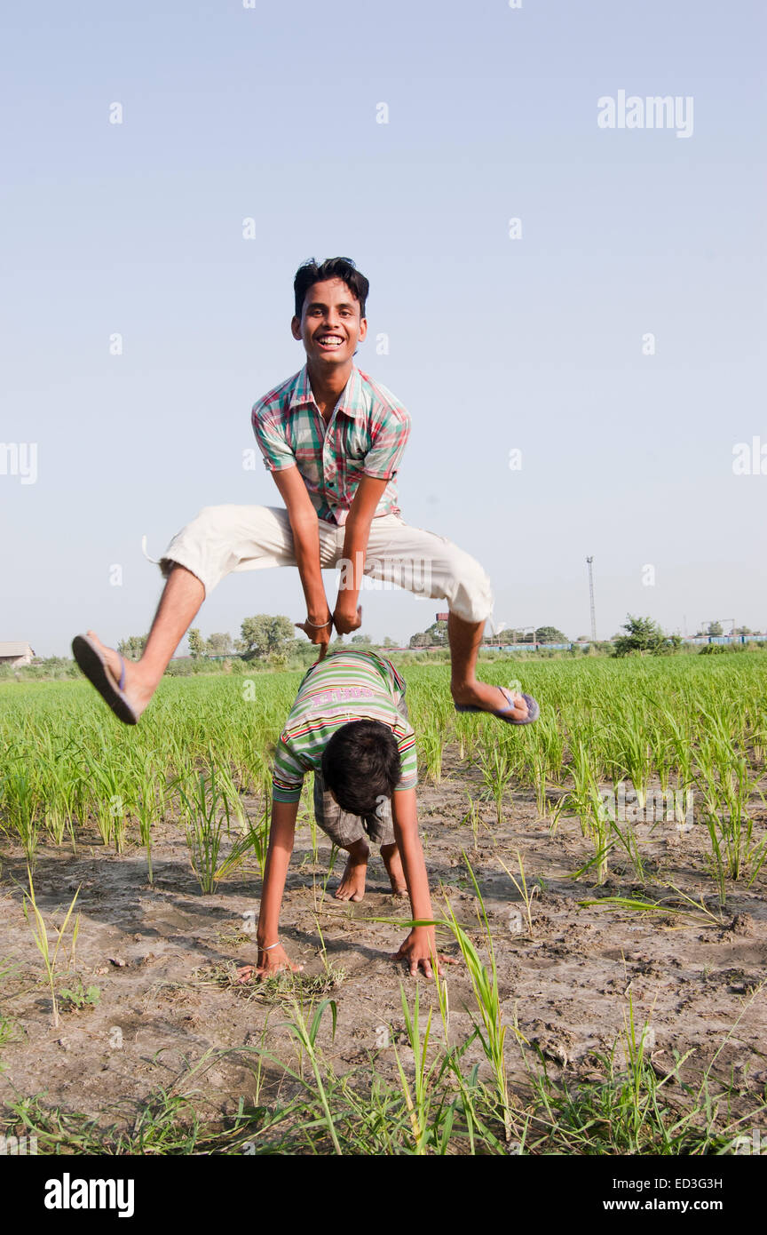 2 indian rural children boys Playing farm Stock Photo