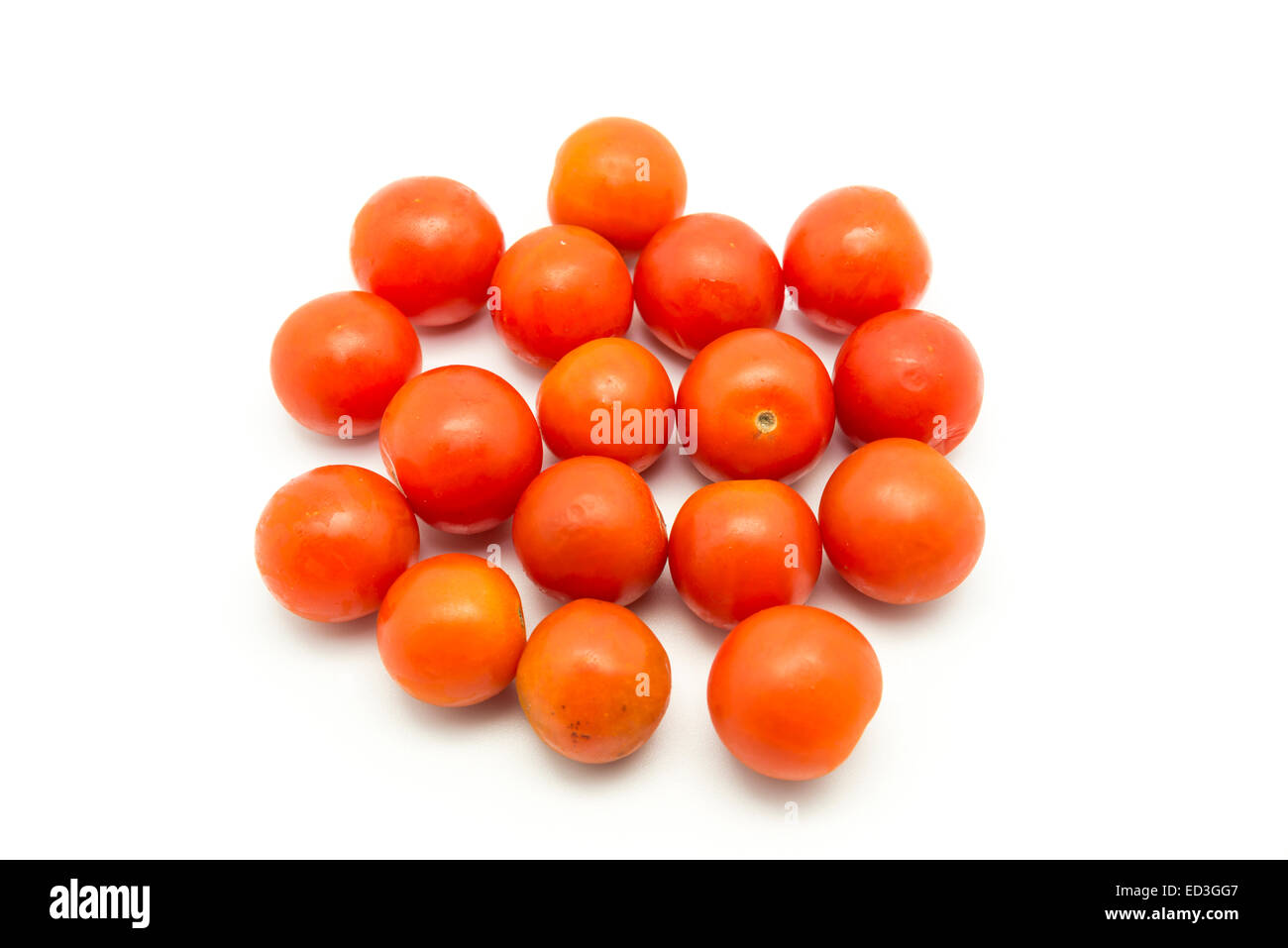 small tomatoes on a white background Stock Photo