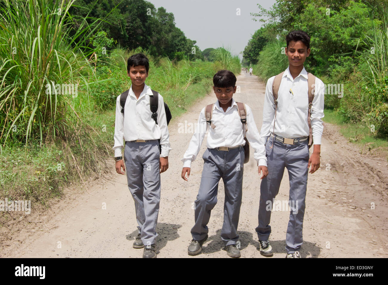 3 indian rural children School Students standing road Stock Photo