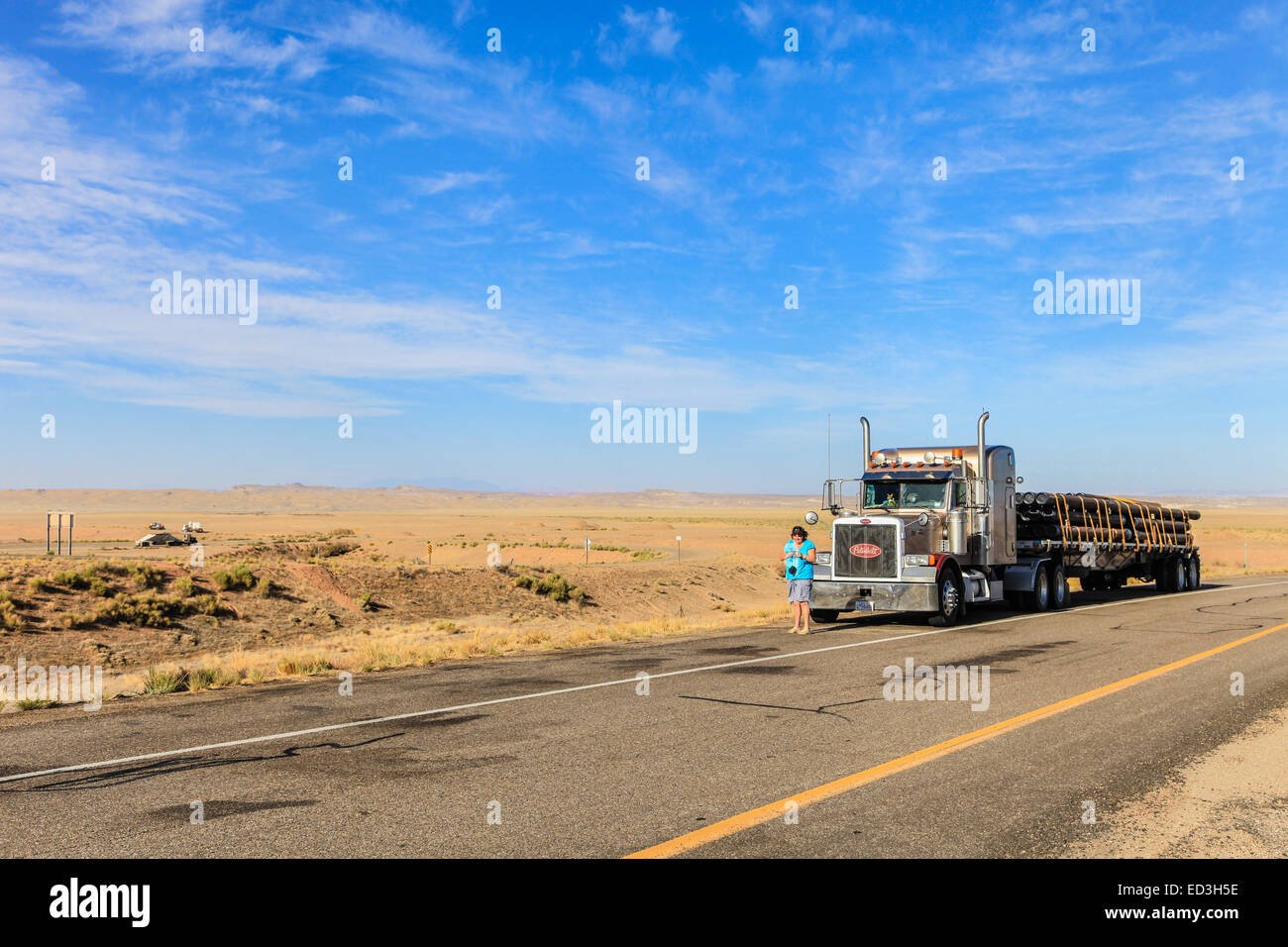 Steel pipe on a Peterbilt 379  flatdeck trailer carrying steel pipe for coal mines Stock Photo