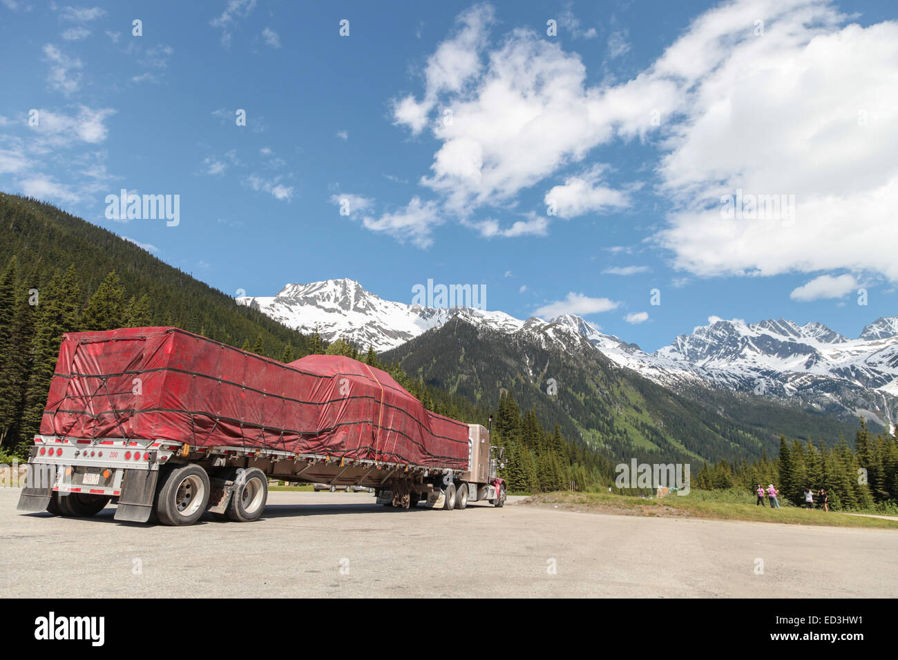 Rogers Pass, BC Canada, Peterbilt 379 parked with load of covered lumber on trailer Stock Photo