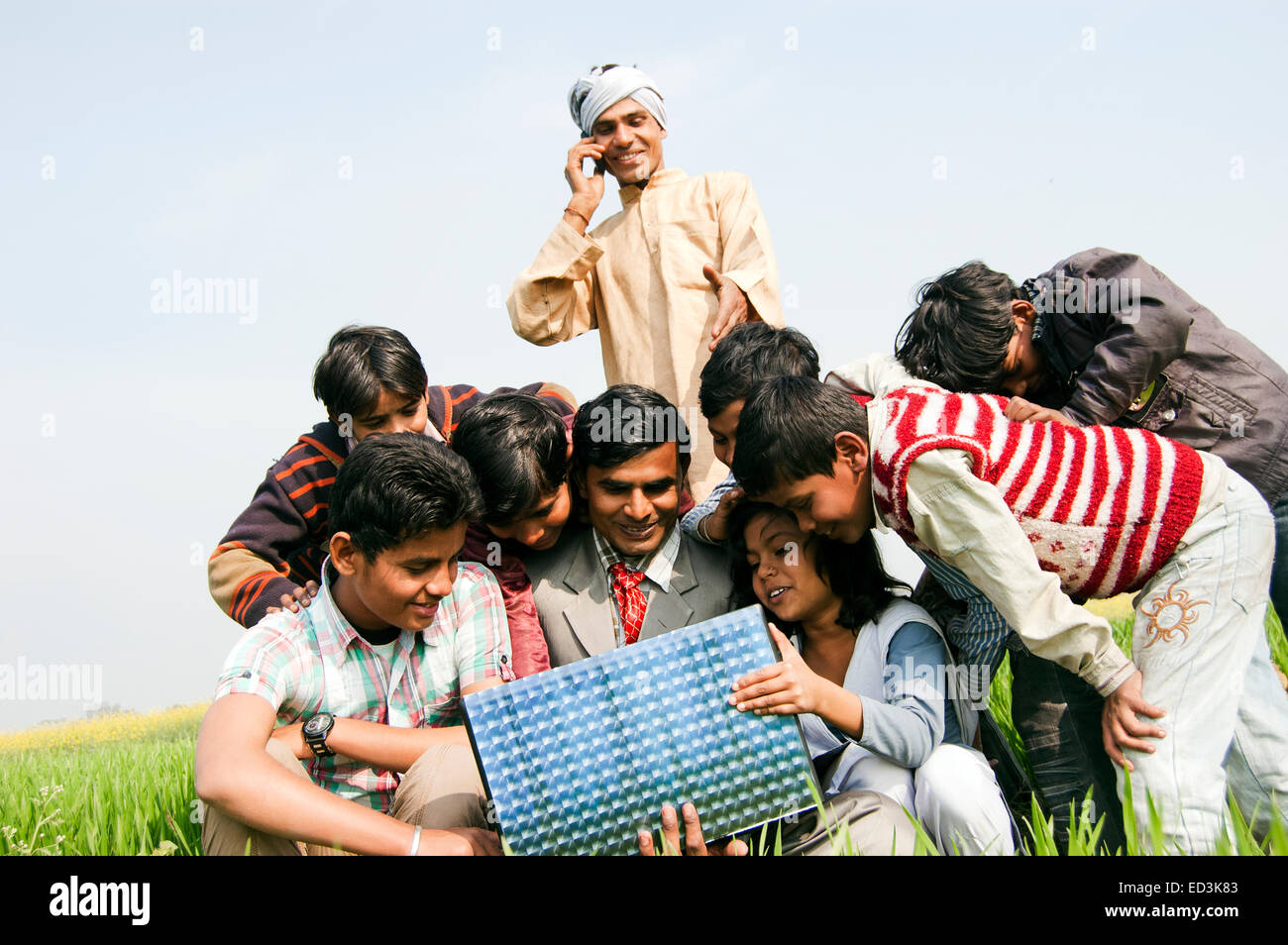 indian rural  Farmer family with Business Man laptop working Stock Photo
