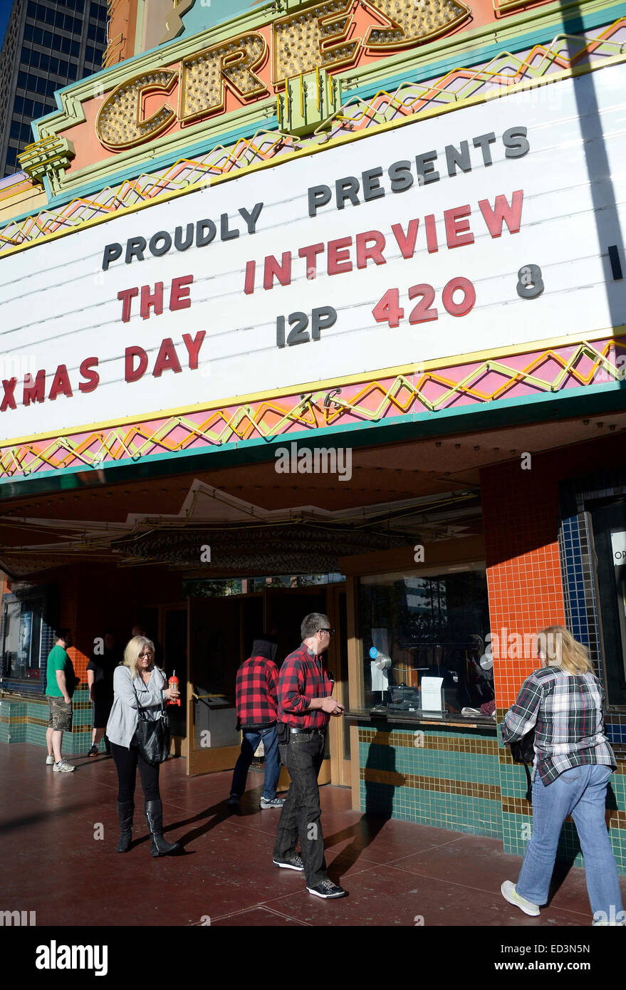 Movie goers come out of the Crest theater in Westwood after seeing The