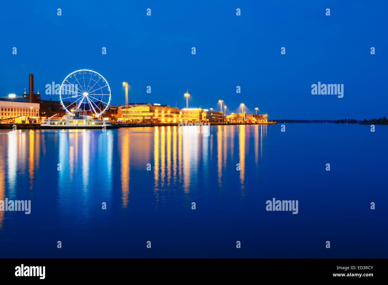 Night Scenery Panoramic View Of Embankment With Ferris Wheel In Helsinki, Finland Stock Photo