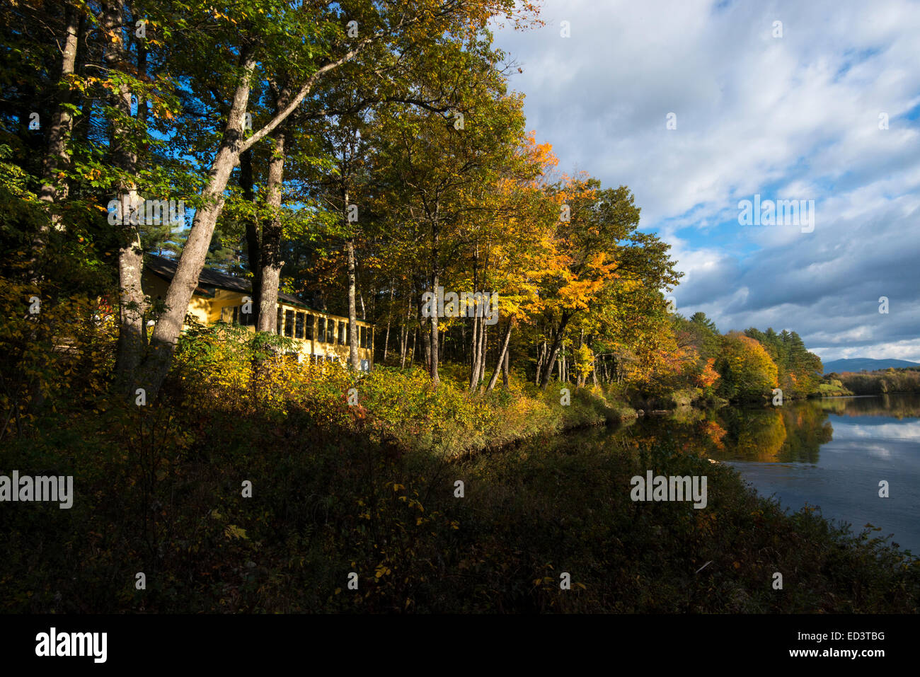 Fall colors on New Hampshire river Stock Photo