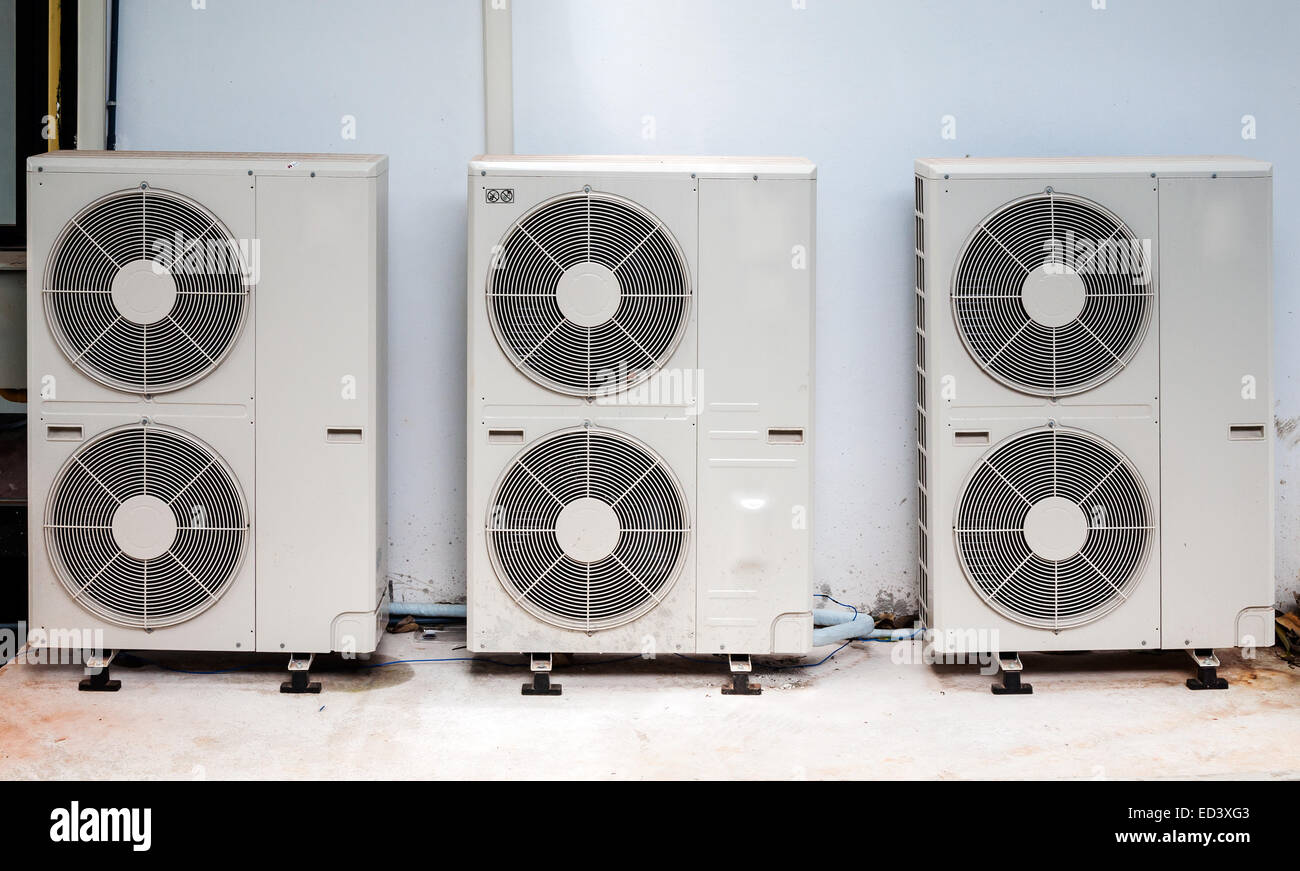 Triple compressor unit behind the office building Stock Photo - Alamy