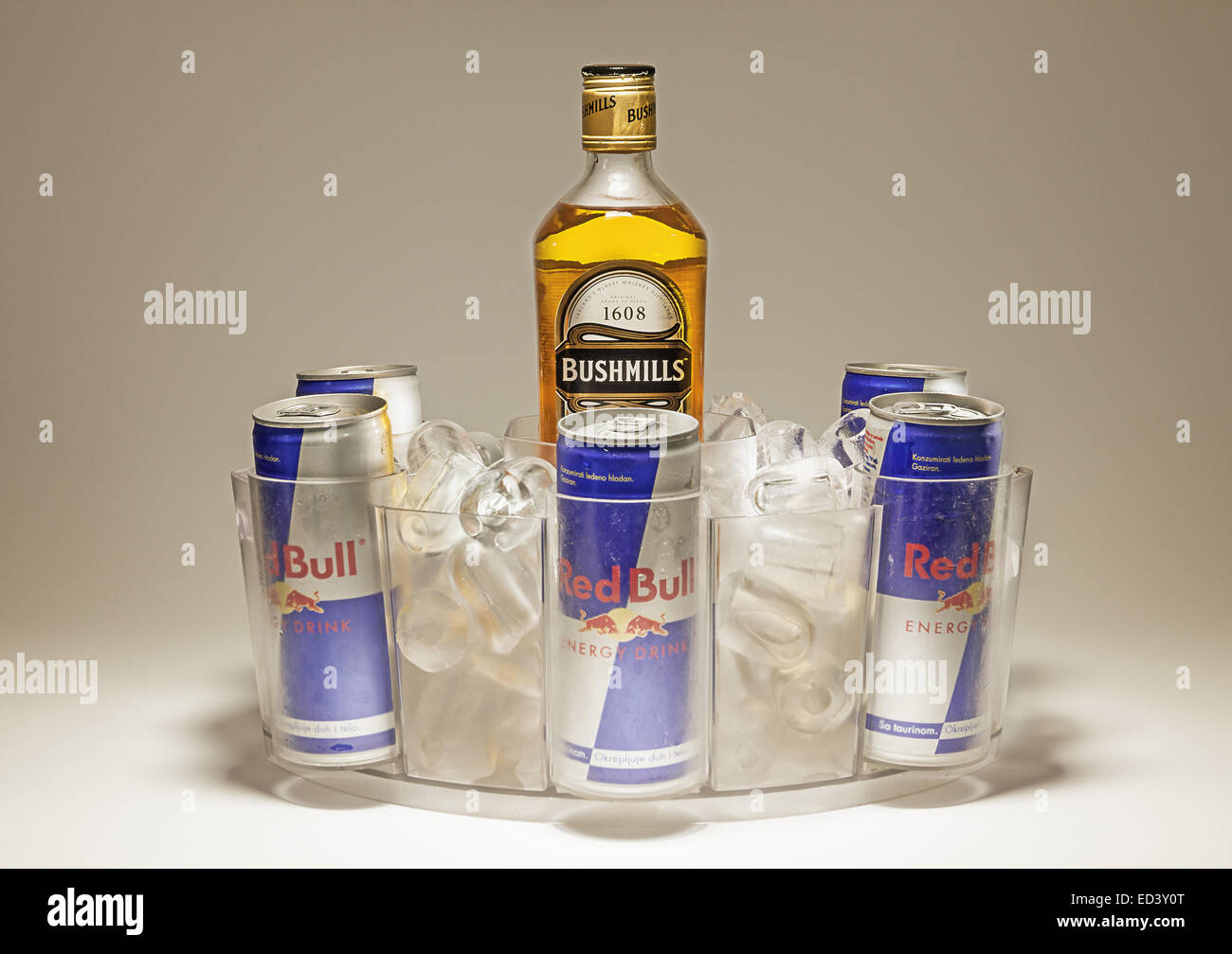 Cacak, Serbia - September 20, 2014: Bushmills and Red Bull cans served in special dish with ice. Stock Photo