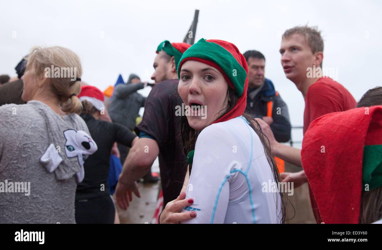 Sidmouth, Devon, UK. 26th December, 2014. Swimmers brave the freezing temperature of the English Sidmouth, Devon, UK. 26th December, 2014. Swimmers brave the freezing temperature of the English