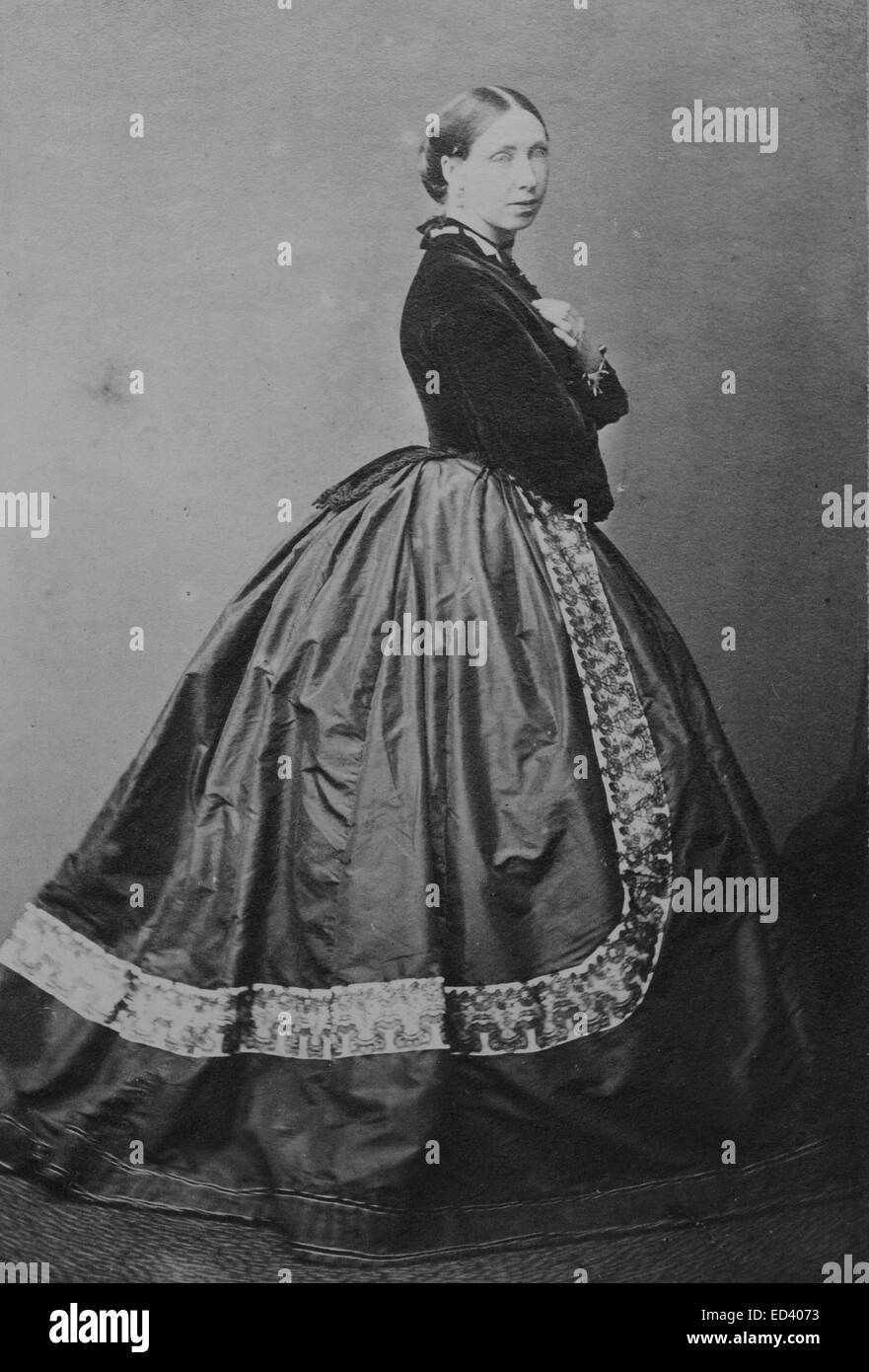 Victorian lady wearing a bustle style dress Stock Photo
