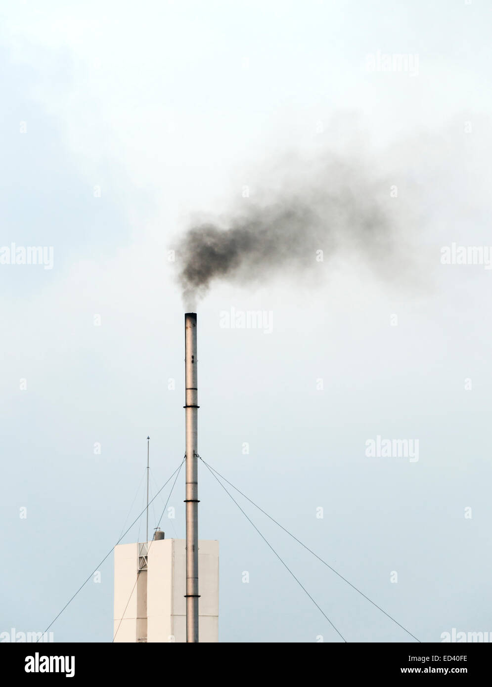 Emissions from the old smokestacks of industrial plants. Stock Photo