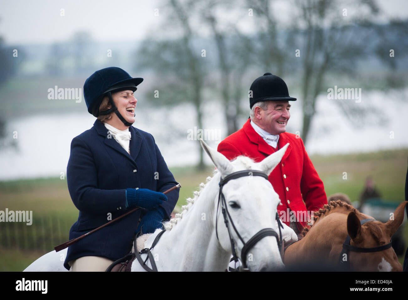Hunters on horses laughing at a joke  Annual Boxing Day meet of the Meynell and South Staffs Hunt at Blethfield Hall, Staffordshire. Credit:  roger askew/Alamy Live News Stock Photo