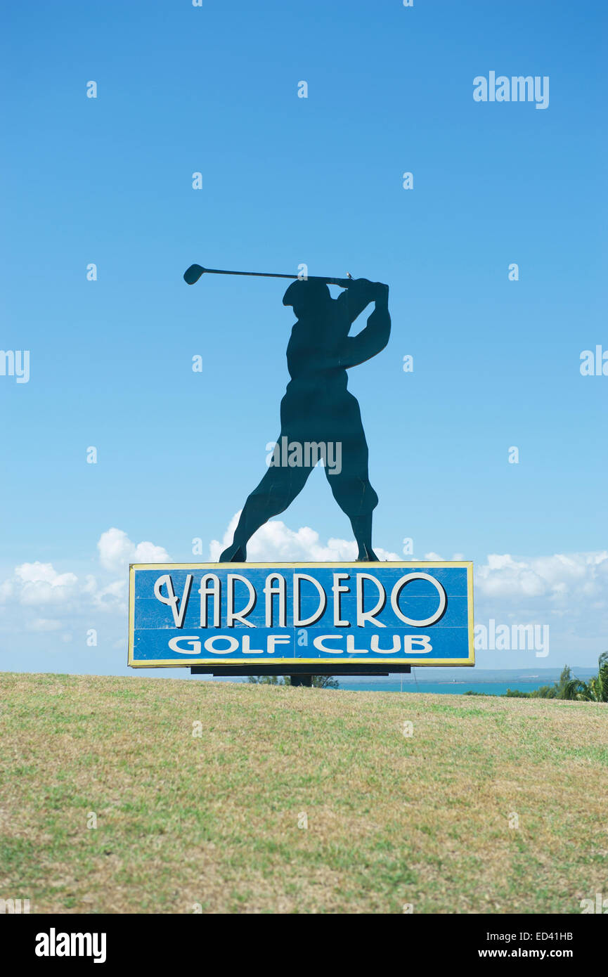 VARADERO, CUBA - MAY 25, 2011: Silhouette of golfer stands atop a sign for the Varadero Golf Club. Stock Photo