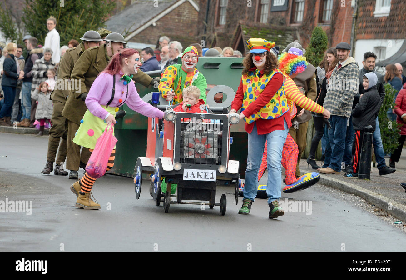 Lewes, UK. 26th Dec, 2014. Villagers competing in their annual Boxing Day Pram Race between the pubs in East Hoathly near Lewes East Sussex. Credit:  Jim Holden/Alamy Live News Stock Photo