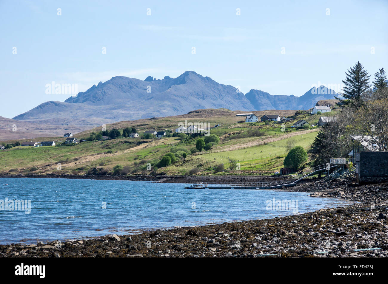 View from beach at Skye village Carbost towards the Cuillin Hills in Scotland Stock Photo