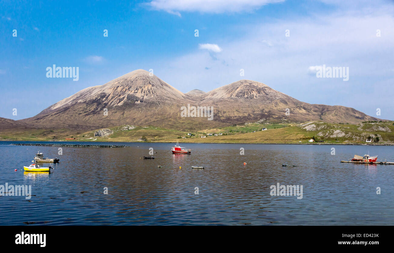 Loch Slapin Skye Scotland with fishing boats and Red Cuillins hills and village of Torrin Stock Photo