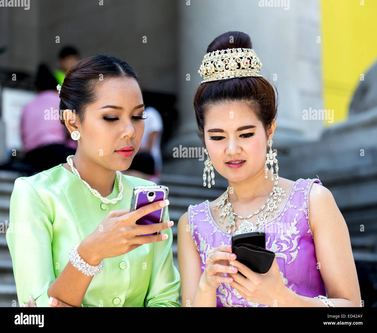 Thai women wearing traditional attire Stock Photo
