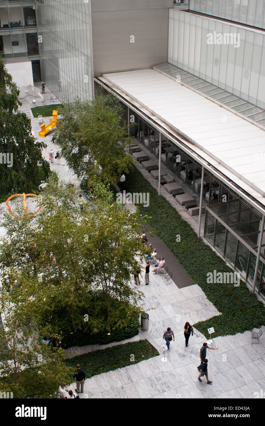 MOMA Museum Garden. Manhattan. NYC. Peace and quiet can be hard to come by in the middle of Manhattan. Maybe, if the ice ever melts, you might balance a lunch burrito on your lap in the sunken plaza outside the McGraw-Hill Building. Or park yourself in a hotel lobby and pretend to be a guest. But for many people the oasis of choice has long been the sculpture garden at the Museum of Modern Art, a soothing half-acre of stone flooring and spouting fountains that provides a brief respite from the madness of Midtown. For a price. Access to the garden required a $25 admission to the museum. Stock Photo