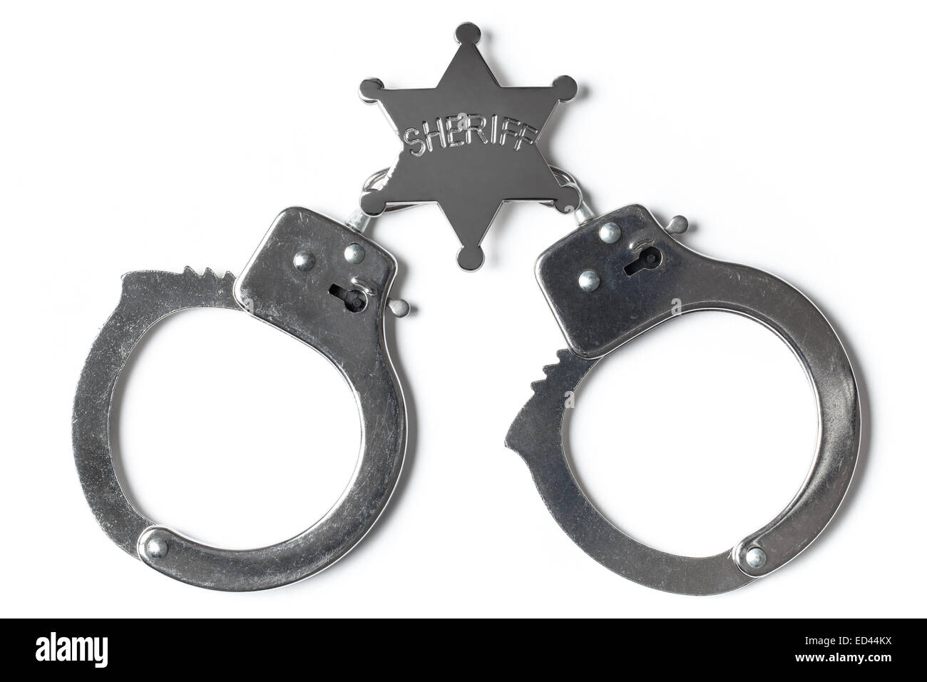 Sheriff's star and locked handcuffs isolated on white background Stock Photo