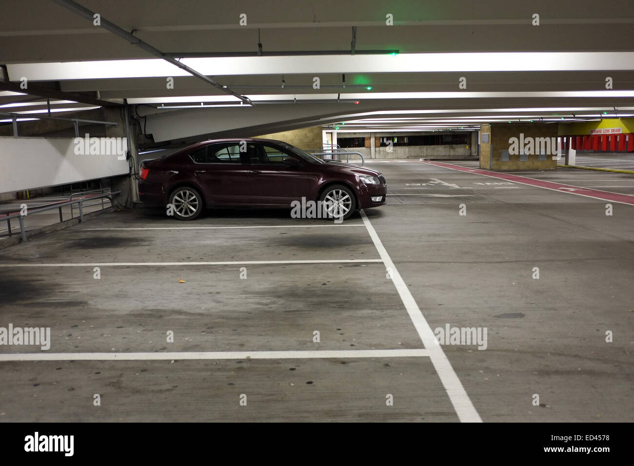 Almost empty multistory car park in Bristol, With a single parked car