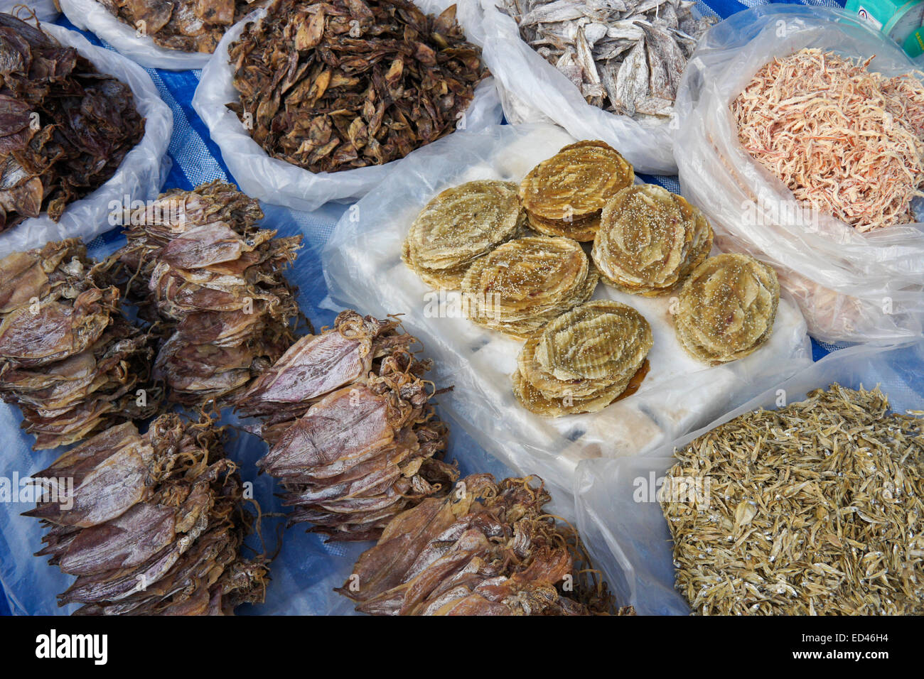 Dried fish and seafood for sale in market, Laos Stock Photo