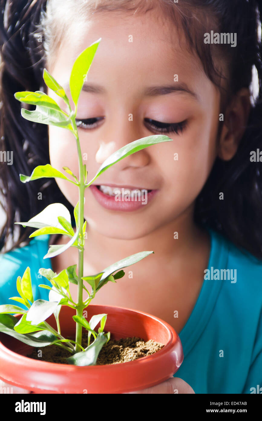 1 indian child girl Potted Plant care Stock Photo - Alamy