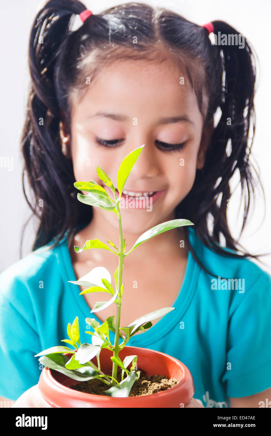 1 indian child girl Potted Plant care Stock Photo Alamy