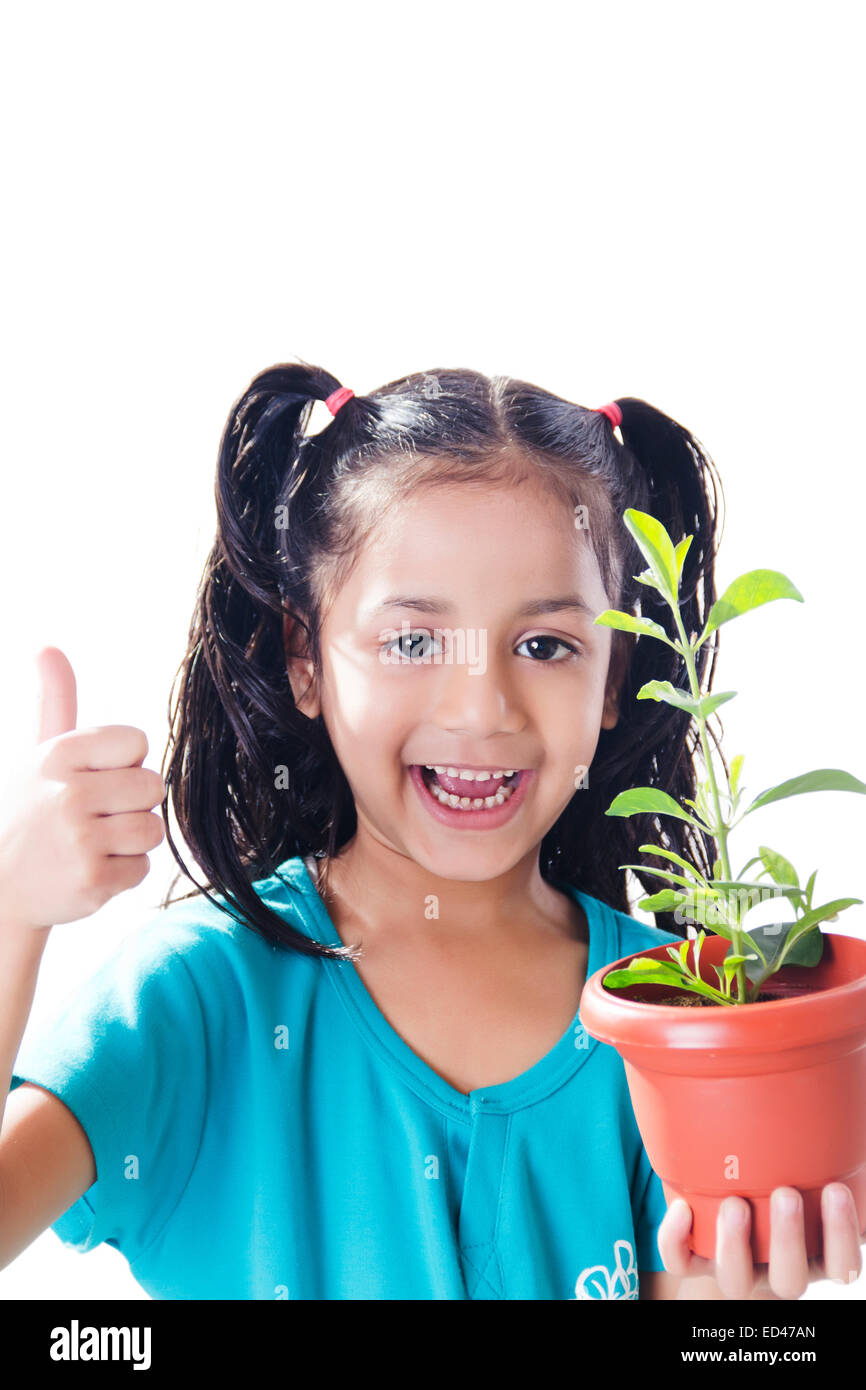 1 indian child girl Potted Plant care Stock Photo - Alamy