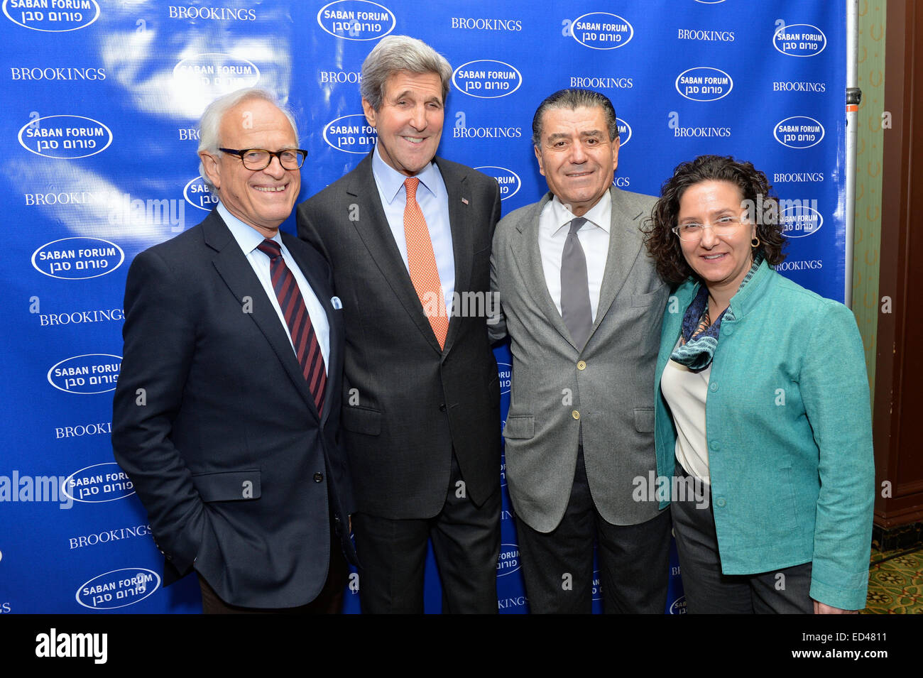 U.S. Secretary of State John Kerry poses for a photo with Ambassador Martin Indyk, Brookings' vice president and director of the Foreign Policy Program, and Saban Forum Chairman Haim Saban at the Brookings Institution's 2014 Saban Forum in Washington, D.C., on December 7, 2014. Stock Photo