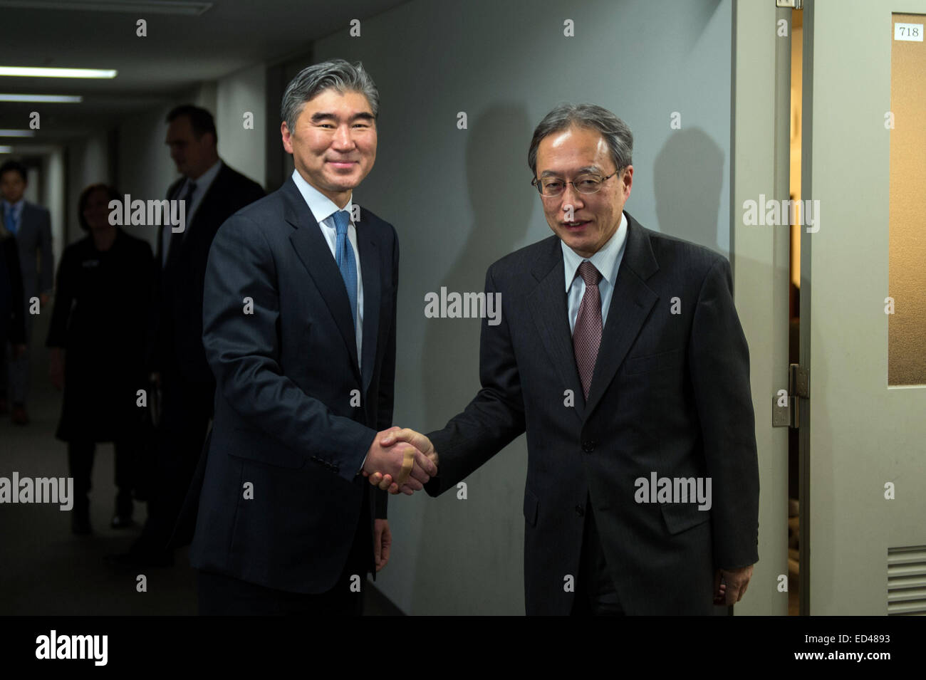 Special Representative for North Korea Policy Sung Kim is greeted by Junichi Ihara, Director-General of the Asian and Oceanian Affairs Bureau, Ministry of Foreign Affairs, before their meeting in Tokyo, Japan, on December 8, 2014. Stock Photo