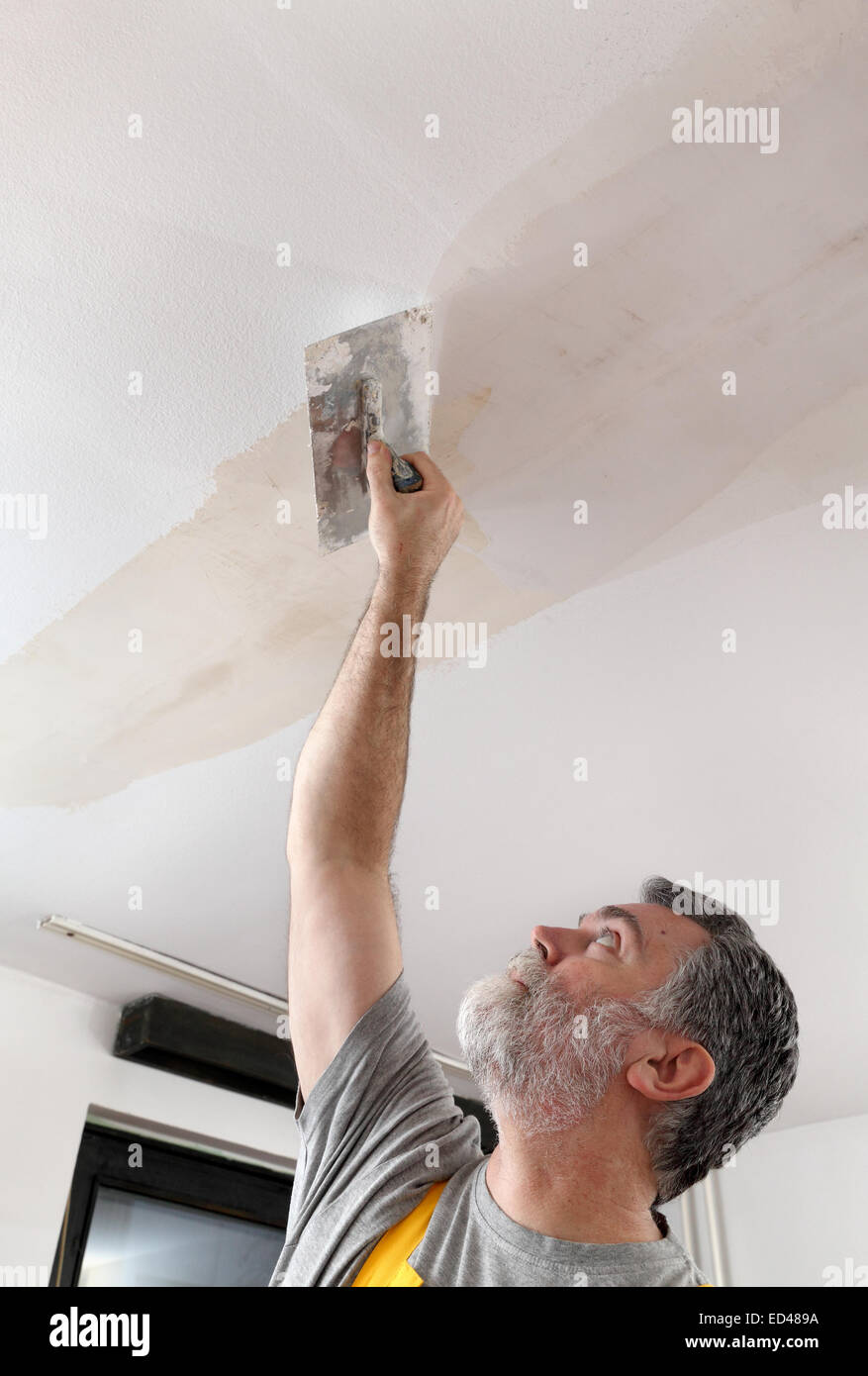 Spreading Plaster Ceiling Trowel Repairing Stock Photos