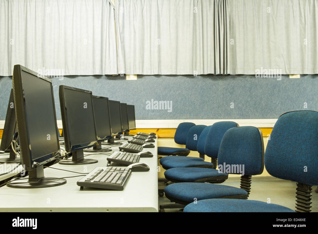 Picture a classroom equipped with personal computers with LCD monitors ...