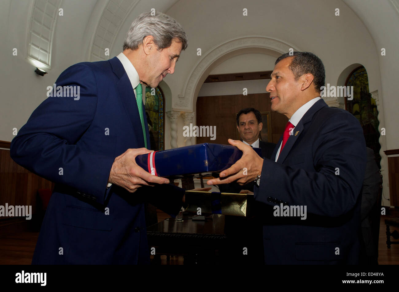 U.S. Secretary of State John Kerry and President Ollanta Humala of Peru exchange gifts following a bilateral meeting in the Presidential Palace in Lima, Peru, on Dec. 11, 2014, and after the Secretary addressed the 20th session of the Conference of the Parties to the United Nations Framework Convention on Climate Change. Stock Photo