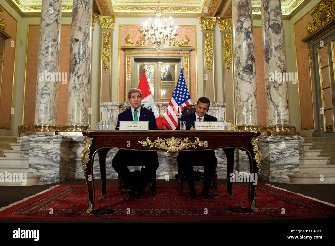 U.S. Secretary of State John Kerry and President Ollanta Humala of Peru deliver a pair of statements to news reporters following a bilateral meeting in the Presidential Palace in Lima, Peru, on Dec. 11, 2014, and after the Secretary addressed the 20th session of the Conference of the Parties to the United Nations Framework Convention on Climate Change. Stock Photo