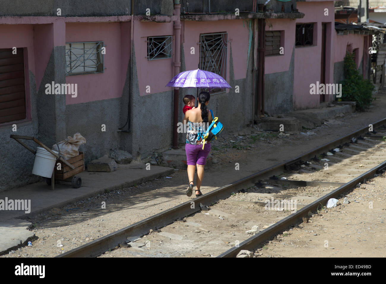 Women carrying child in Cuba Stock Photo