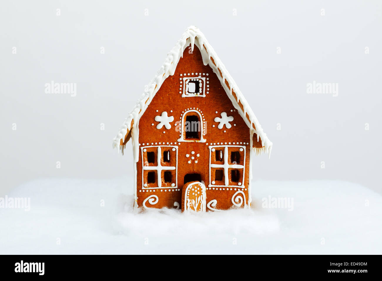 The hand-made eatable gingerbread house and snow decoration Stock Photo