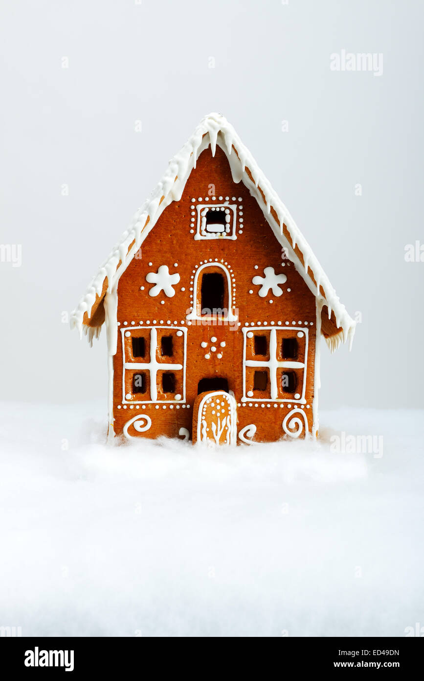 The hand-made eatable gingerbread house and snow decoration Stock Photo