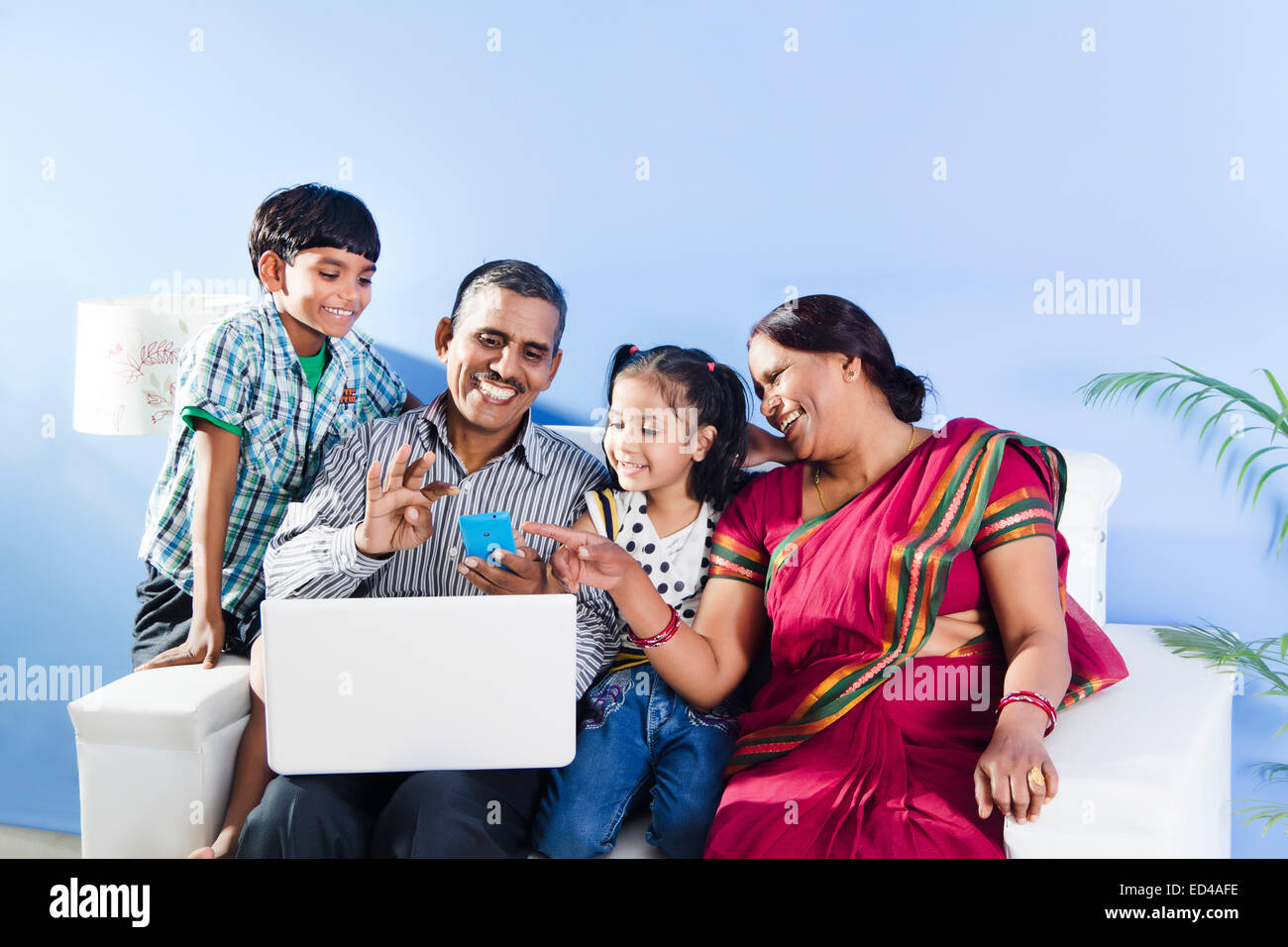 indian Parents with children laptop working Stock Photo ...